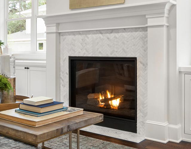 white herringbone tile fireplace